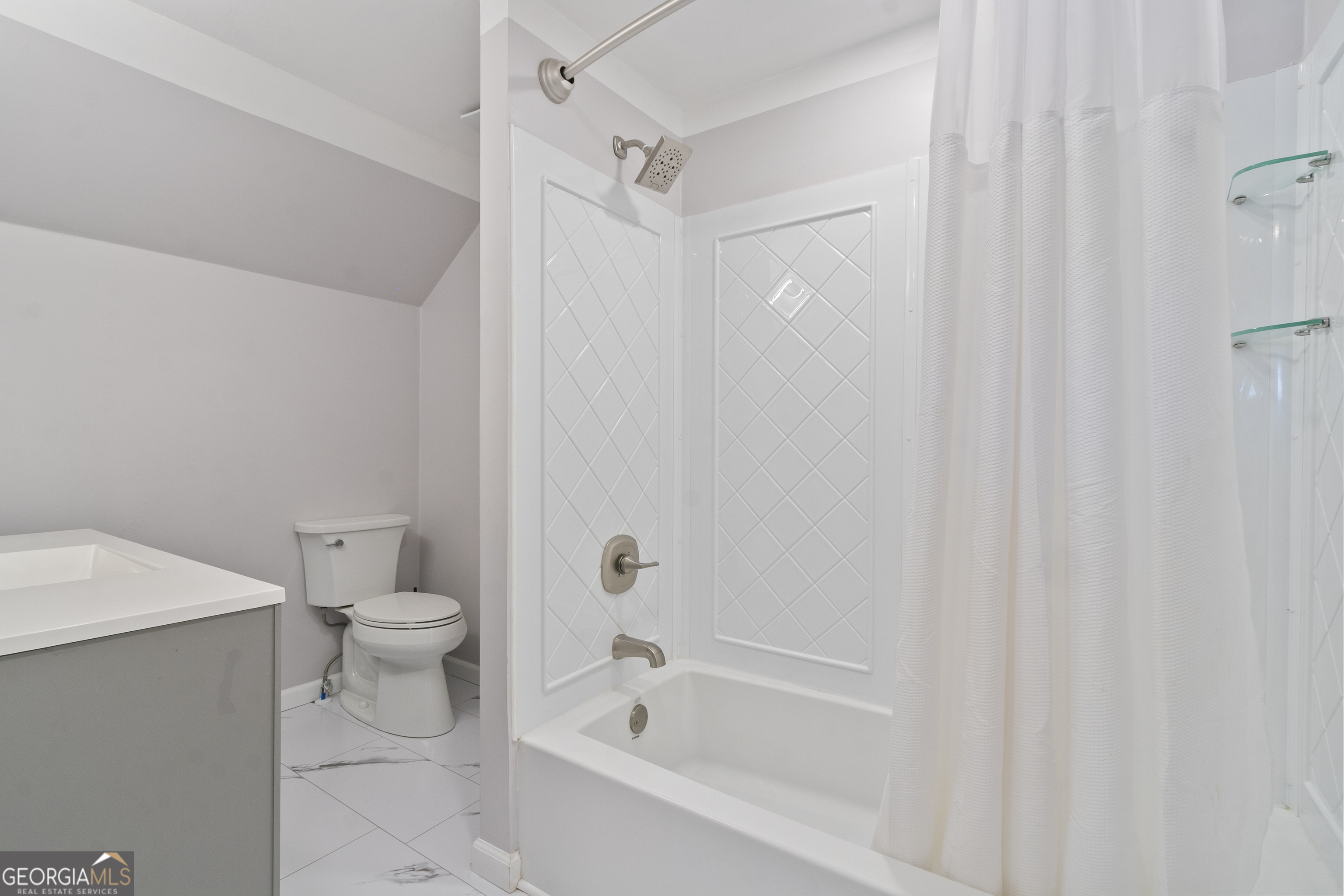 61 Clark Street Newnan, GA 30263 - Photo 24 of 37 a bathroom with a toilet and a bathtub