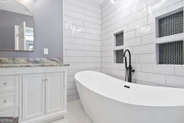 a bathroom with a sink and a vanity