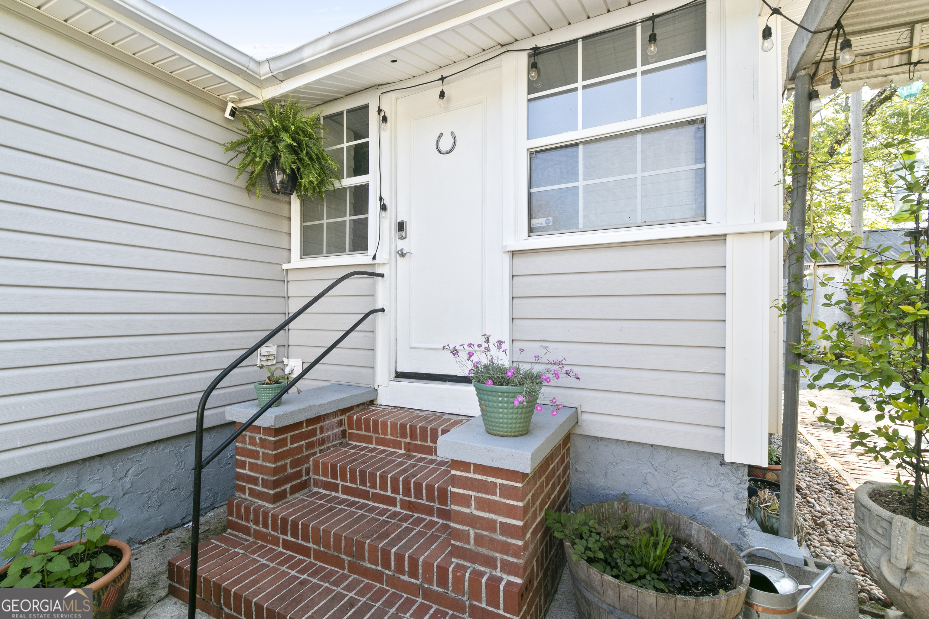 61 Clark Street Newnan, GA 30263 - Photo 31 of 37 a house view with a garden space