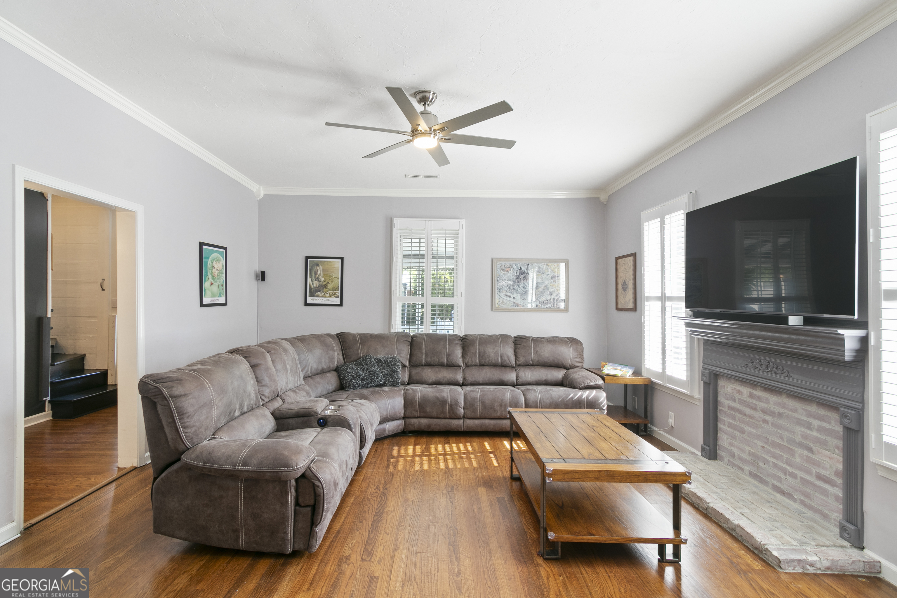 61 Clark Street Newnan, GA 30263 - Photo 7 of 37 a living room with furniture and a flat screen tv