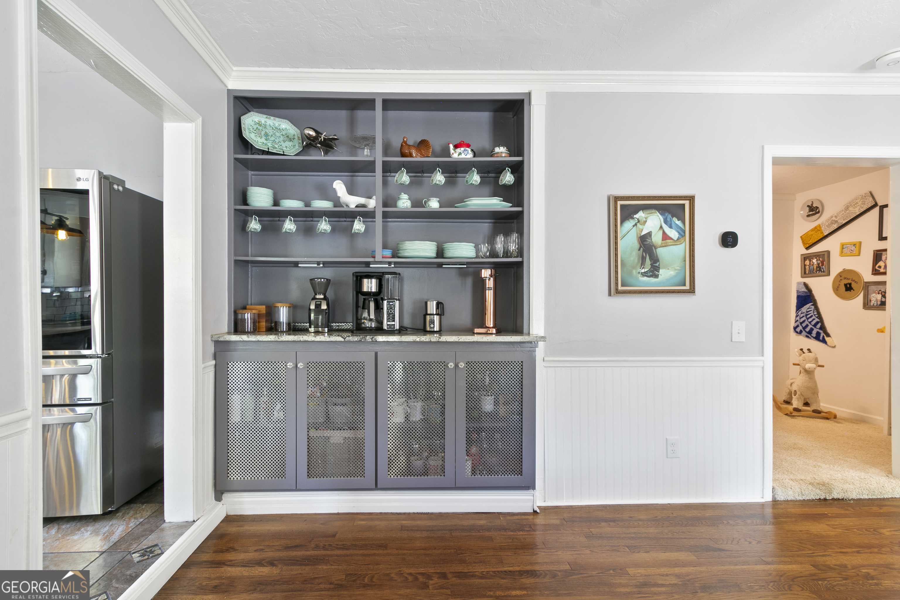 61 Clark Street Newnan, GA 30263 - Photo 8 of 37 a view of open kitchen with wooden floor and cabinet