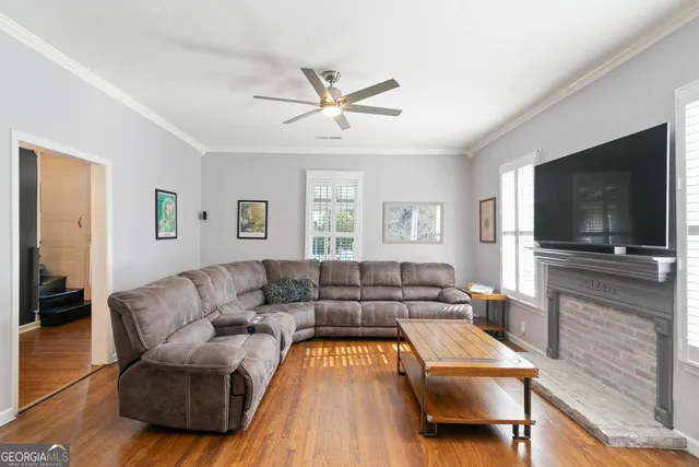 a living room with furniture and a flat screen tv