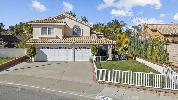a front view of a house with garage