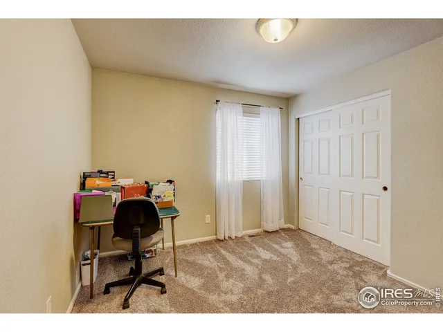 a workspace with furniture and a window