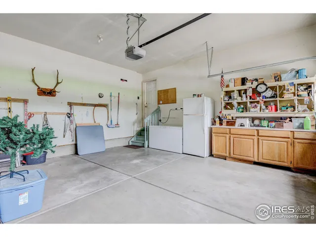 a kitchen with cabinets and window