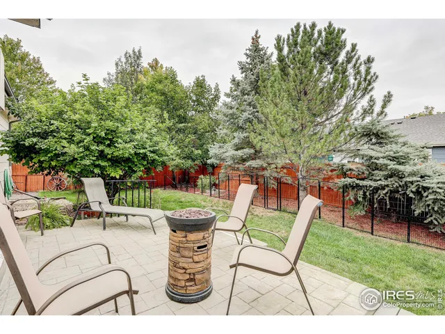 a view of a chairs and table in the garden