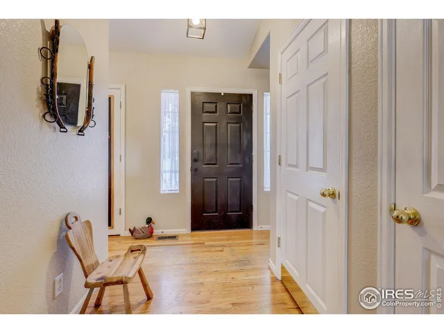 a view of a livingroom with wooden floor and closet