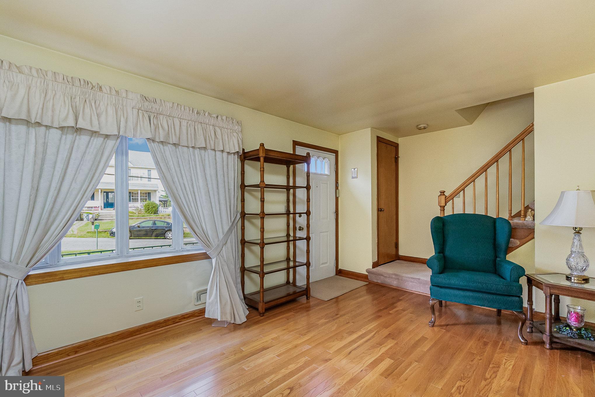 7925 35th Street Rosedale, MD 21237 - Photo 8 of 30 a living room with furniture and a wooden floor