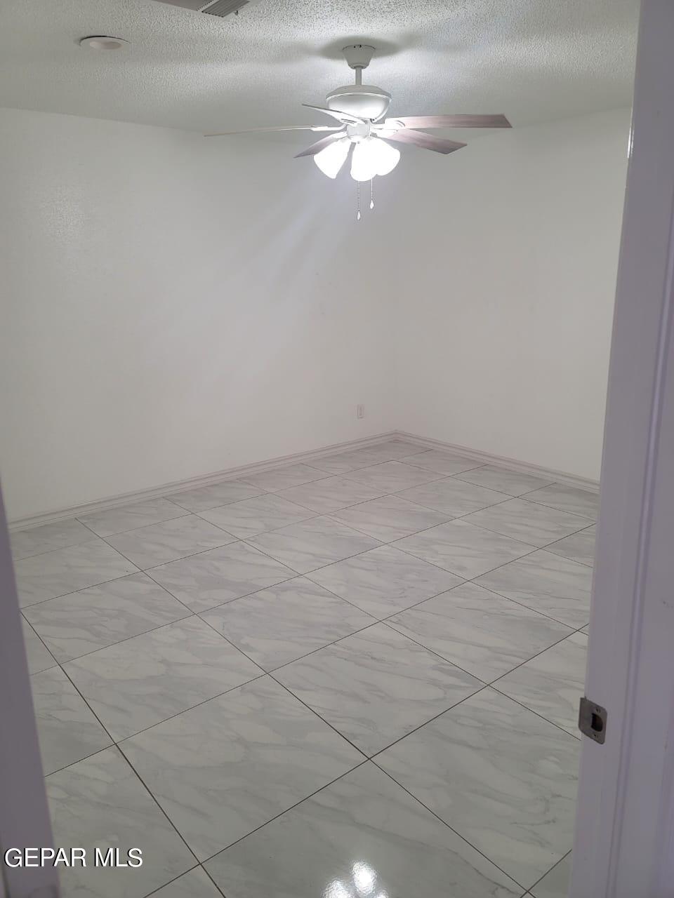 324 Valley Fair Way El Paso, TX 79907 - Photo 13 of 82 a view of a small space with wooden floor and a chandelier fan