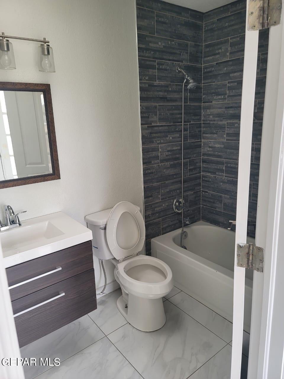 324 Valley Fair Way El Paso, TX 79907 - Photo 80 of 82 a bathroom with a toilet a sink and bathtub