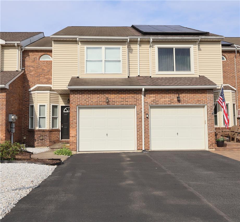 1282 Old Gate Road Northampton, PA 18067 - Photo 1 of 18 A classic brick and siding townhouse features an attached garage and practical solar panels.