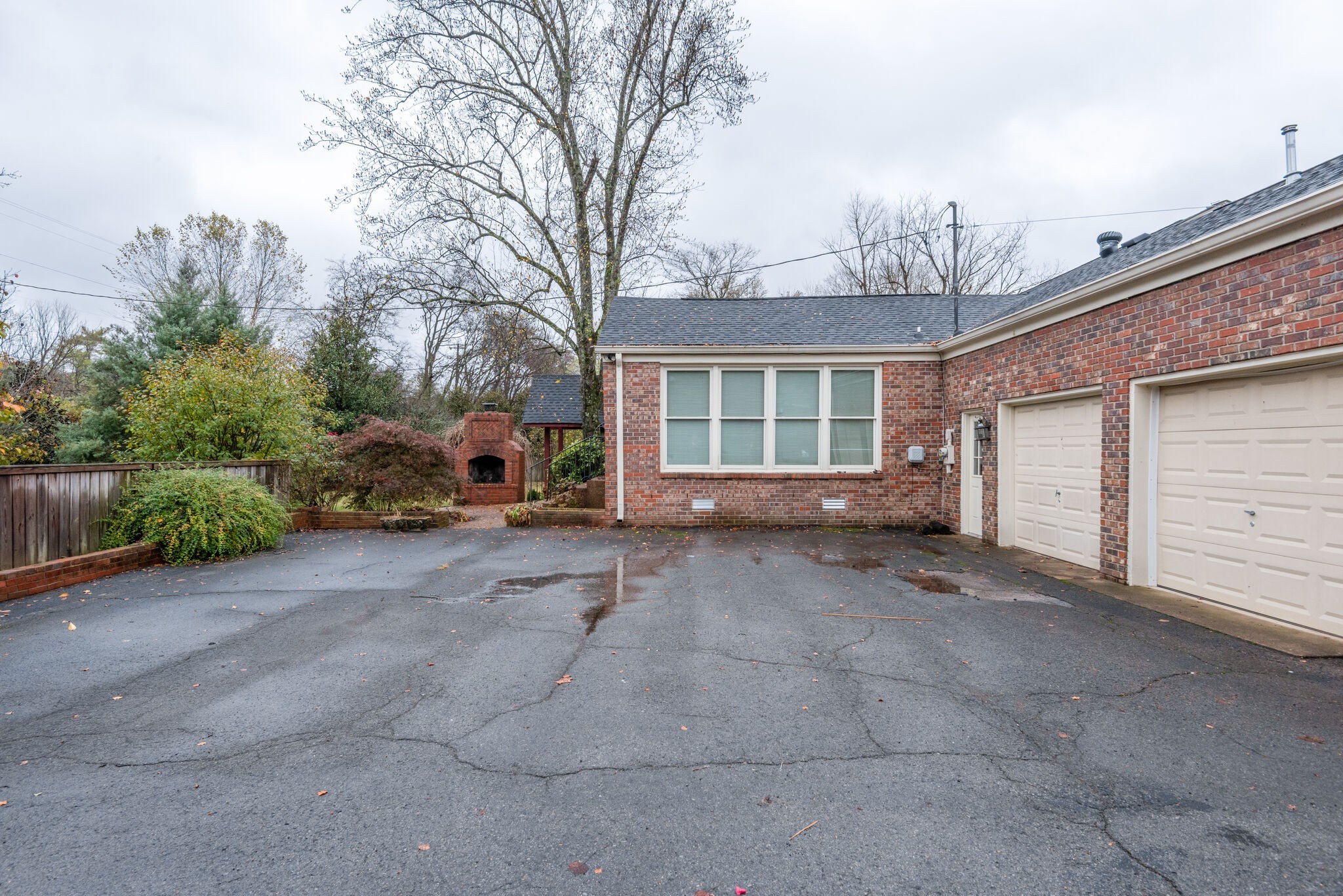 5927 Post Road Nashville, TN 37205 - Photo 20 of 22 a view of a house with a yard and garage