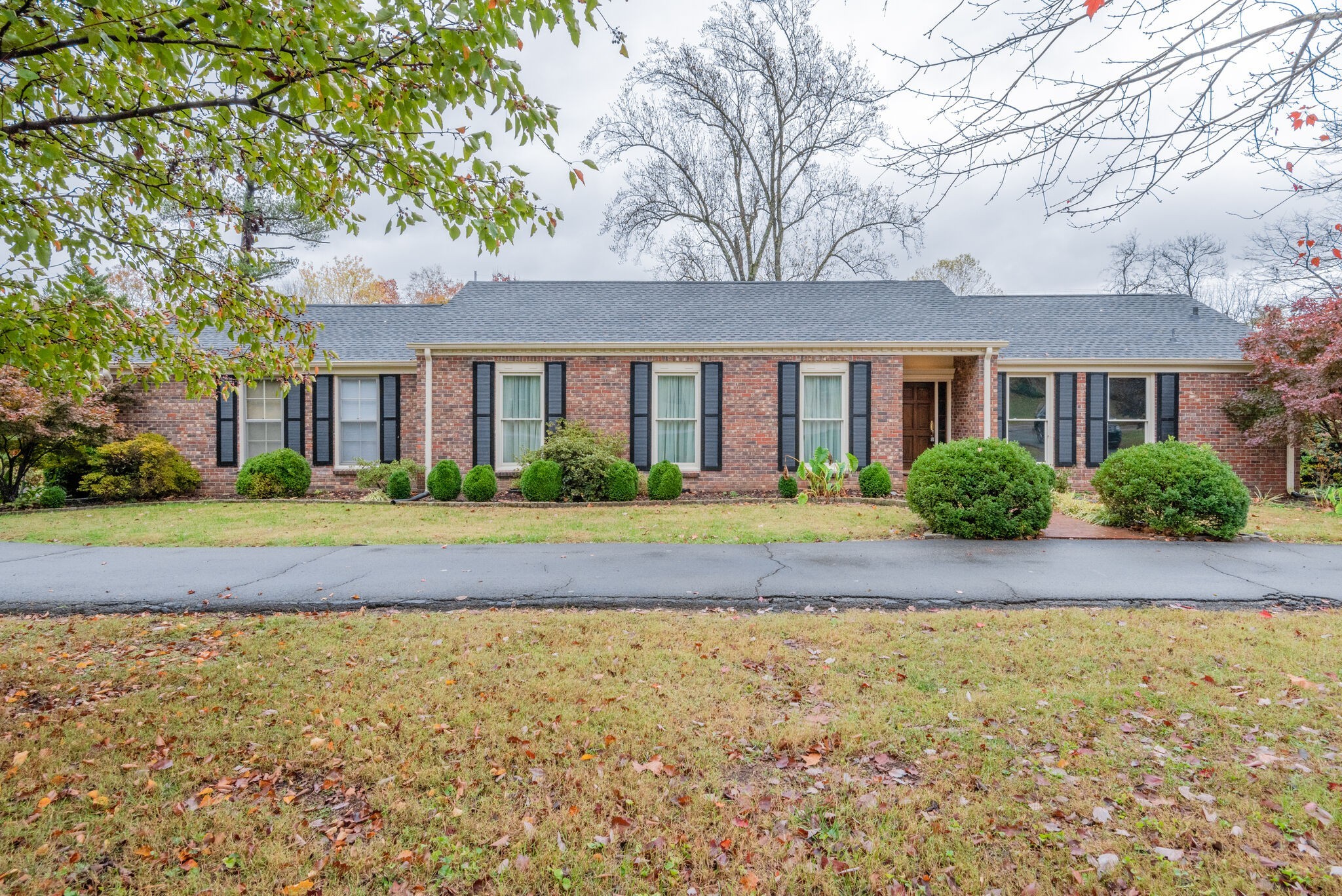 5927 Post Road Nashville, TN 37205 - Photo 2 of 22 a front view of a house with a garden