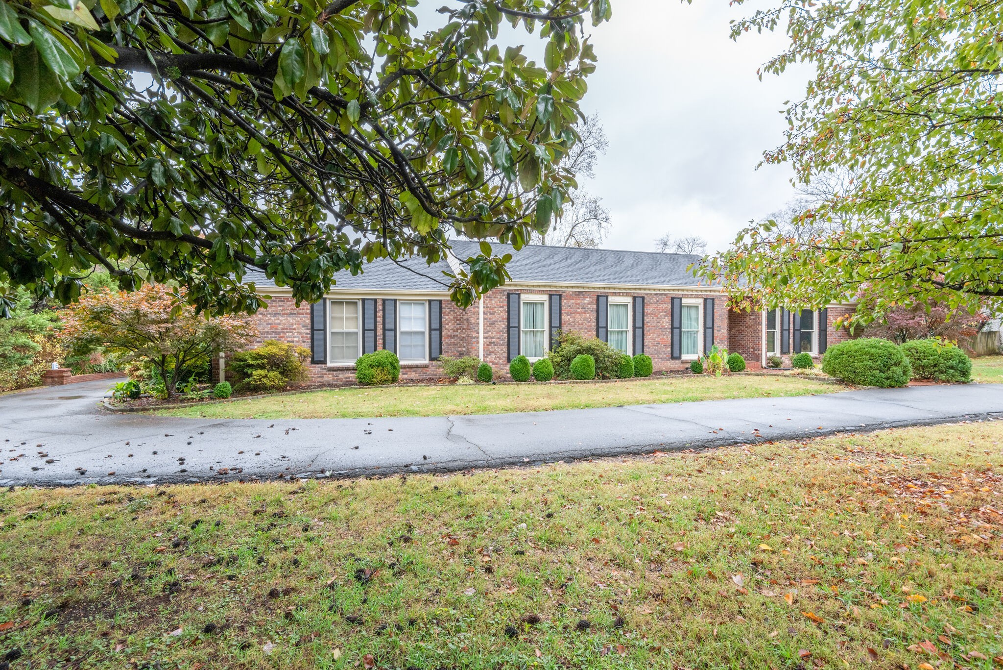 5927 Post Road Nashville, TN 37205 - Photo 3 of 22 a front view of a house with a yard
