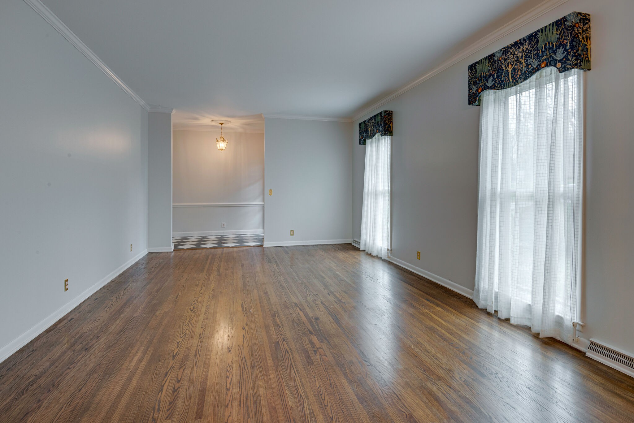 5927 Post Road Nashville, TN 37205 - Photo 7 of 22 an empty room with wooden floor and windows