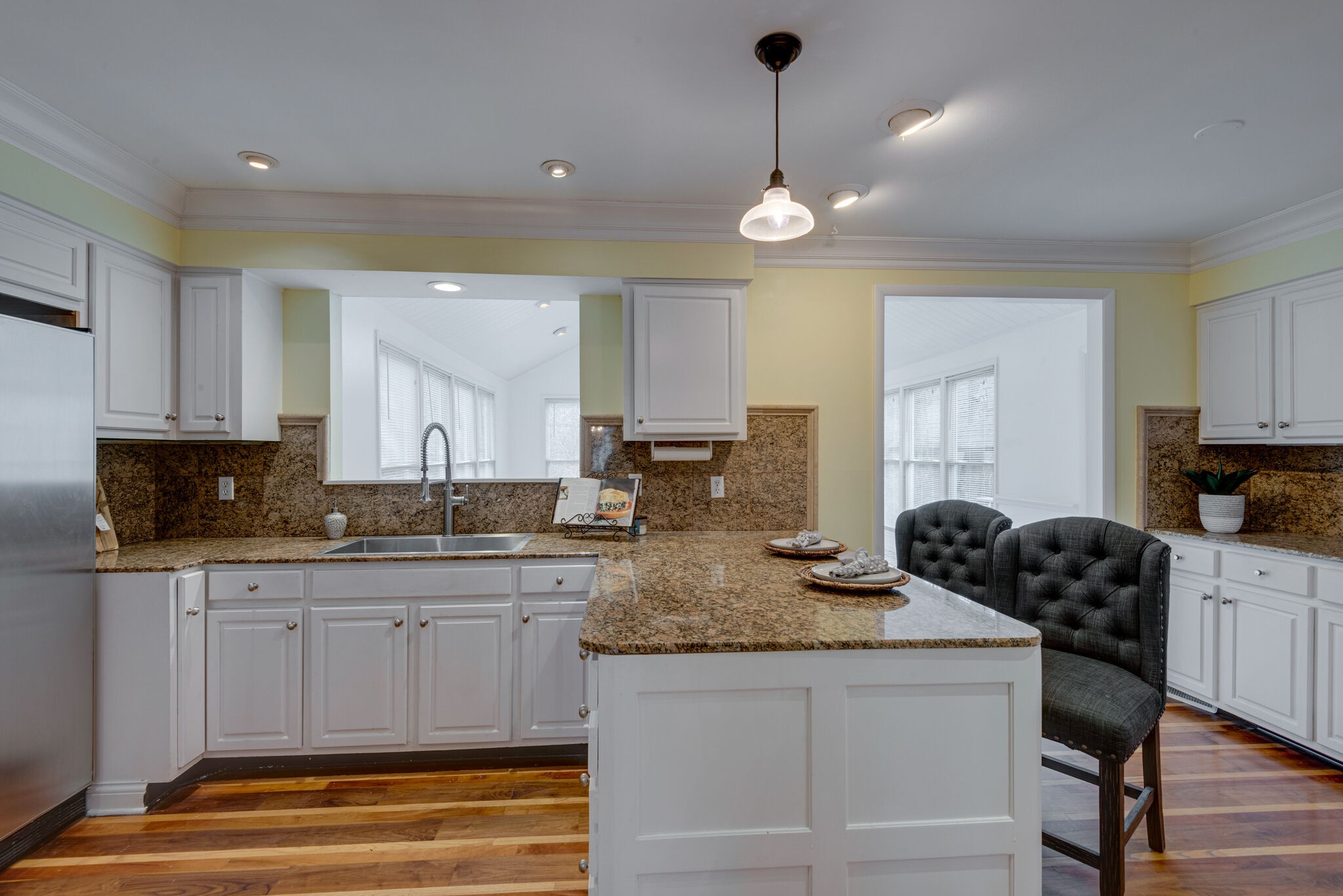 5927 Post Road Nashville, TN 37205 - Photo 9 of 22 a kitchen with granite countertop a sink a stove cabinets and black stainless steel appliances