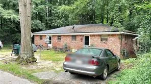 a view of a house with a back yard