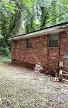 a view of a backyard of the house