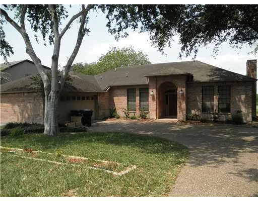 a view of a house with backyard porch and sitting area