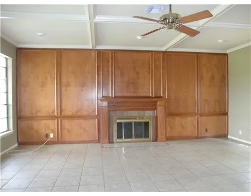 a view of an empty room with a fireplace