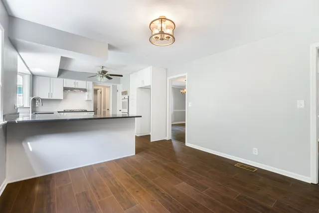 a view of kitchen and wooden floor