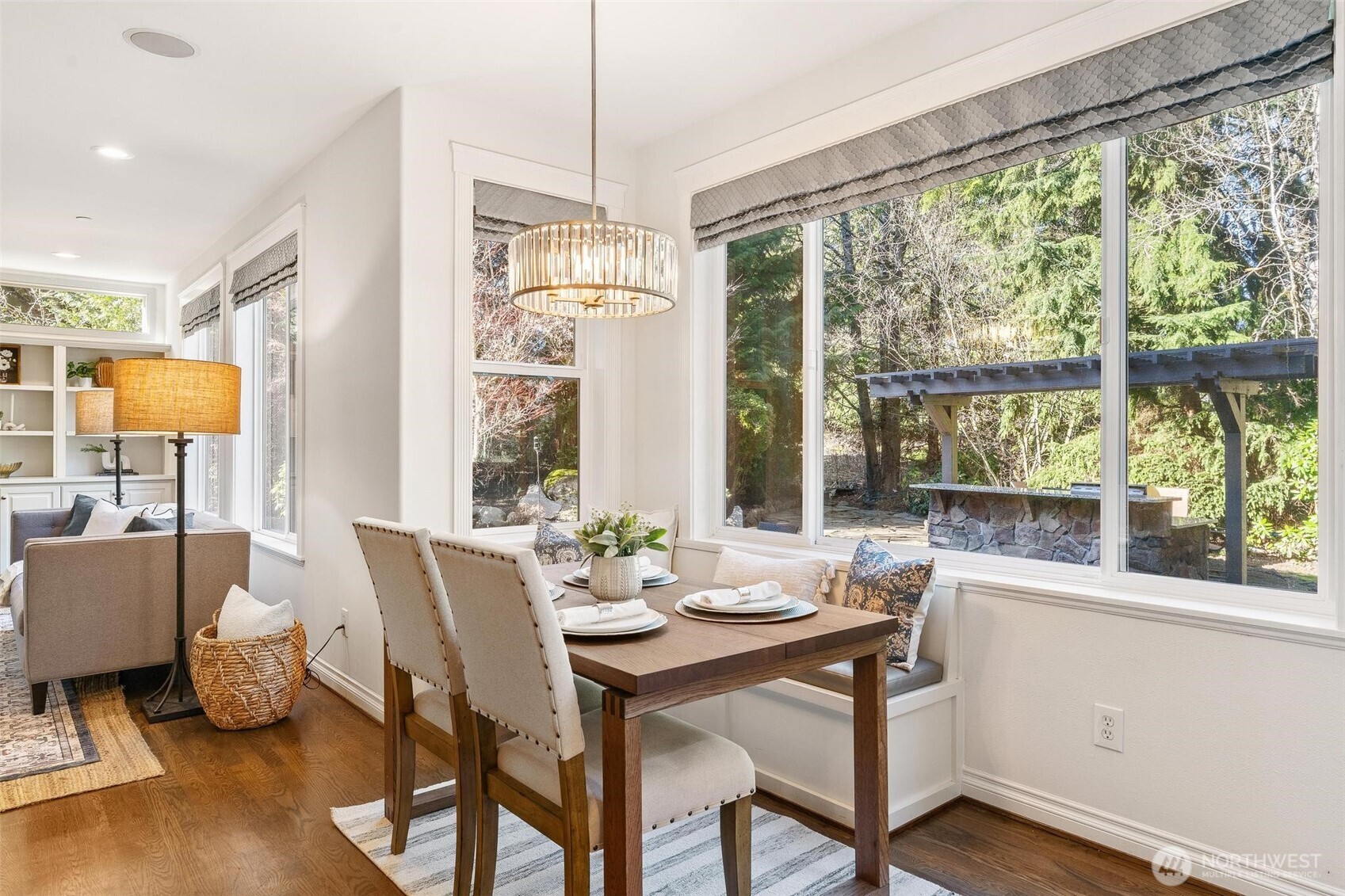 16454 108th Avenue Northeast Bothell, WA 98011 - Photo 12 of 40 a view of a dining room with furniture large windows and wooden floor