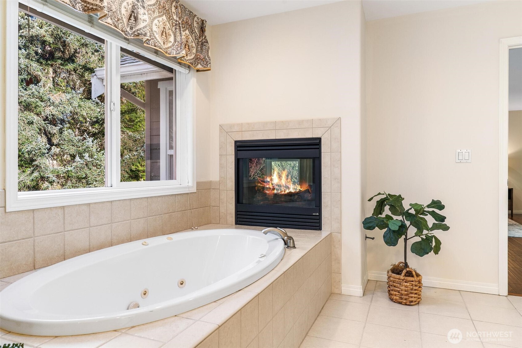 16454 108th Avenue Northeast Bothell, WA 98011 - Photo 20 of 40 a bath tub sitting in a bathroom next to a window