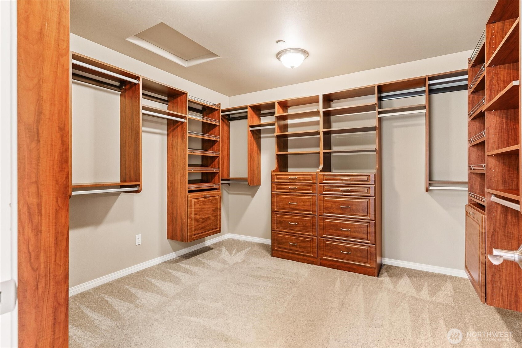 16454 108th Avenue Northeast Bothell, WA 98011 - Photo 21 of 40 a view of walk in closet with clothes and shoes
