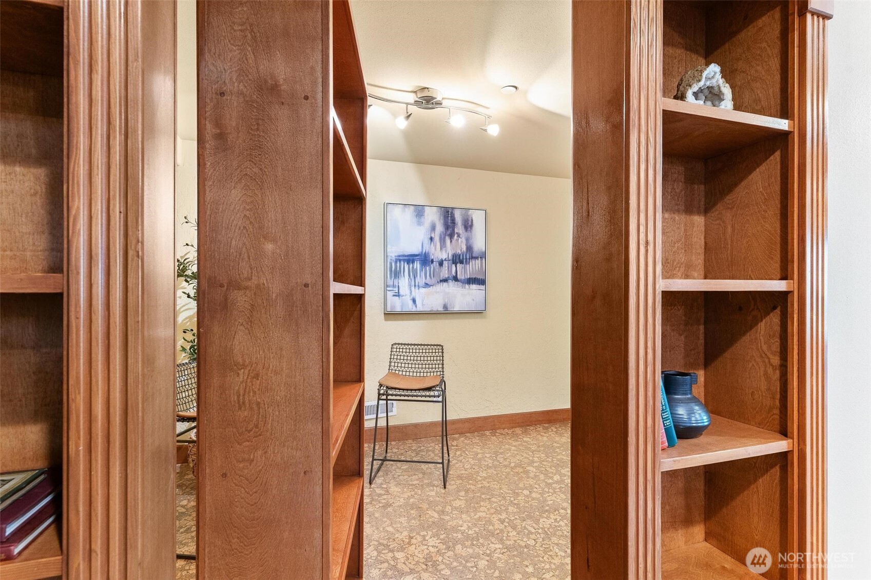 16454 108th Avenue Northeast Bothell, WA 98011 - Photo 28 of 40 a view of a hallway with paintings on the wall