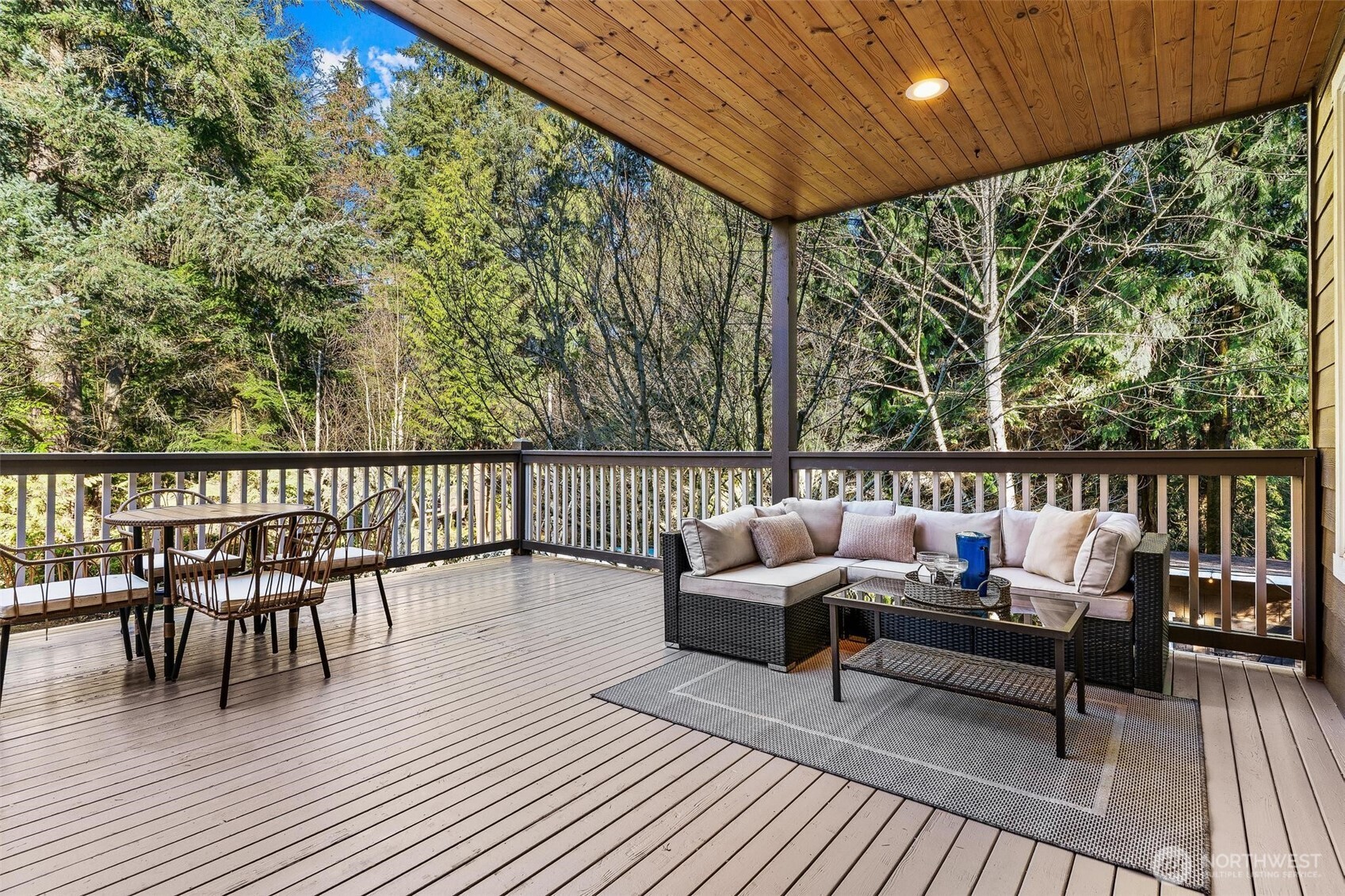 16454 108th Avenue Northeast Bothell, WA 98011 - Photo 34 of 40 a balcony with wooden floor table and chairs