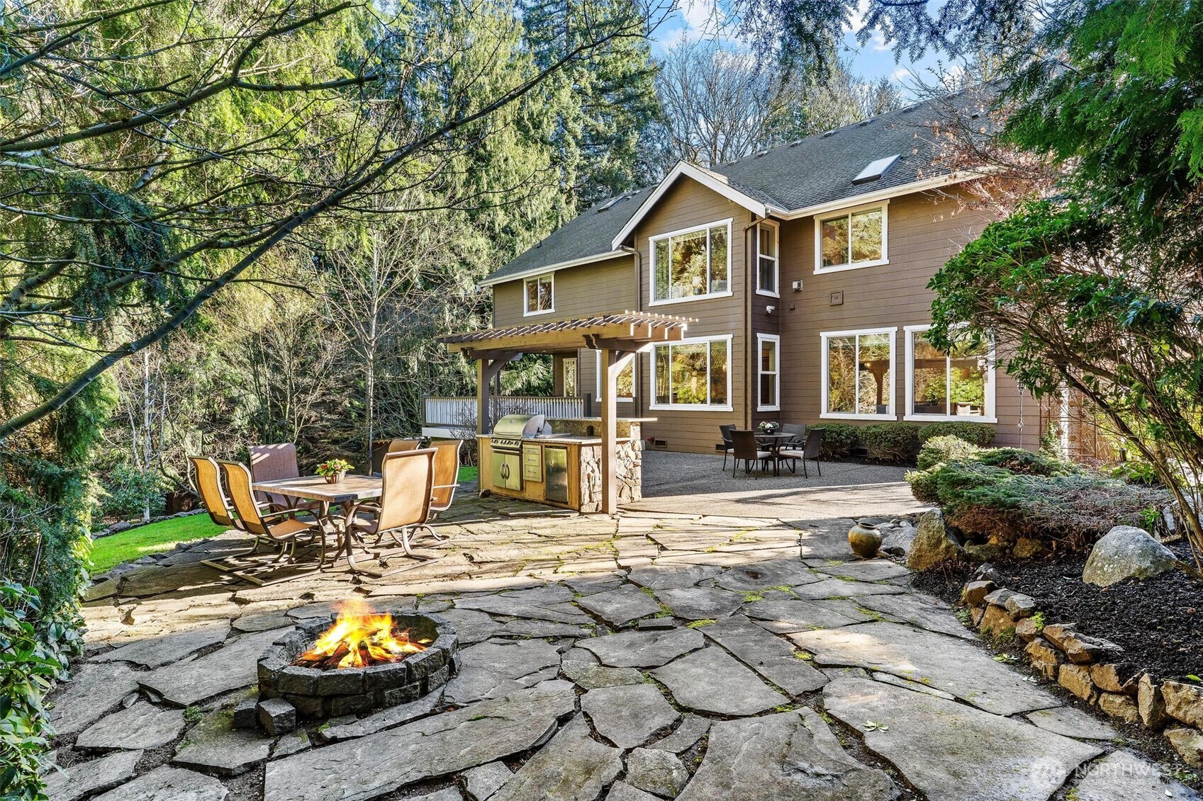 16454 108th Avenue Northeast Bothell, WA 98011 - Photo 37 of 40 a front view of a house with swimming pool and sitting area