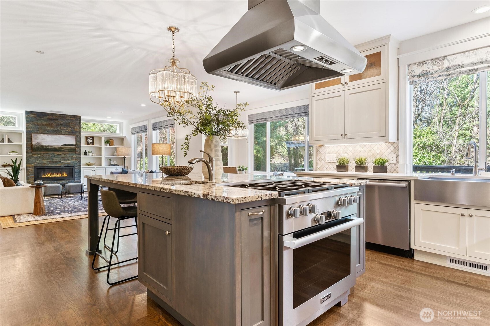 16454 108th Avenue Northeast Bothell, WA 98011 - Photo 7 of 40 a kitchen with stainless steel appliances granite countertop a stove and a wooden floors