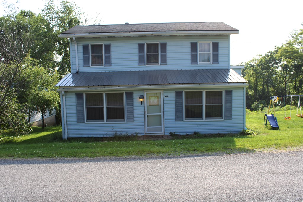 517 Dry Ridge Road Mayport, PA 16240 - Photo 2 of 30 a view of a brick house with a yard large tree and a large window