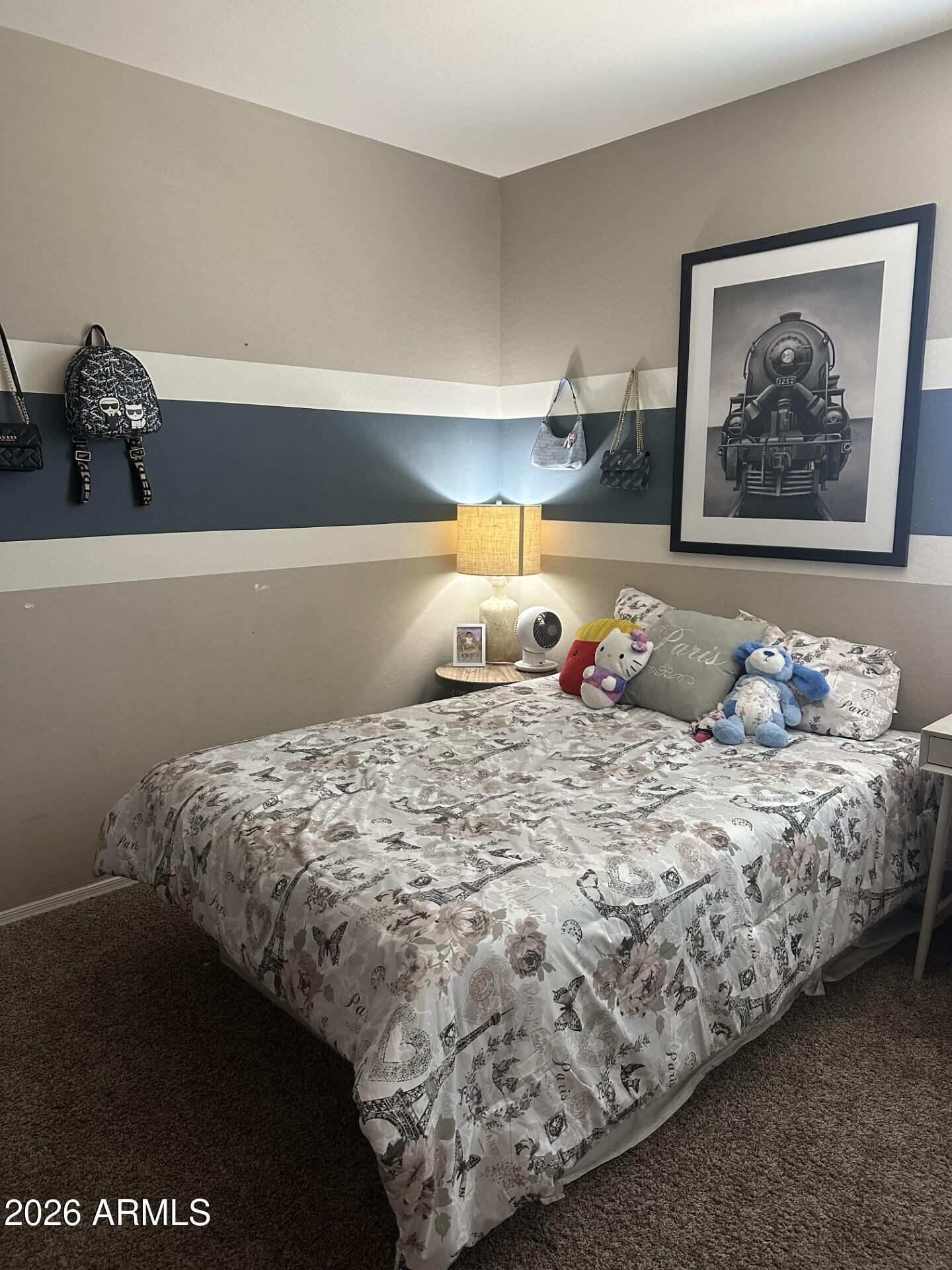7851 West Riverside Avenue Phoenix, AZ 85043 - Photo 31 of 40 a bedroom with a bed and painting on the wall
