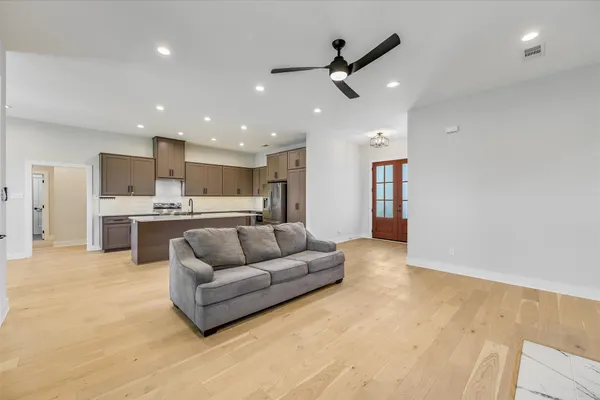 a living room with furniture and a fireplace