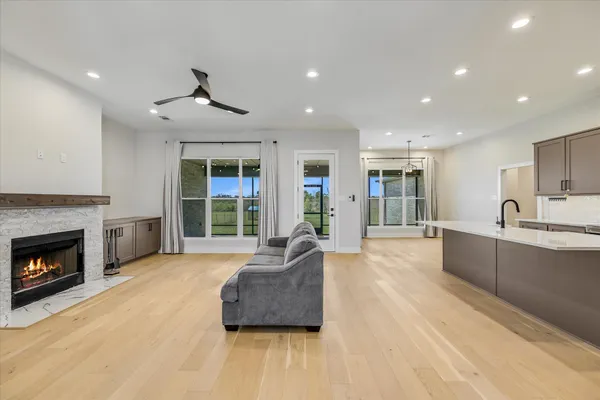 a kitchen with stainless steel appliances granite countertop a refrigerator sink and stove