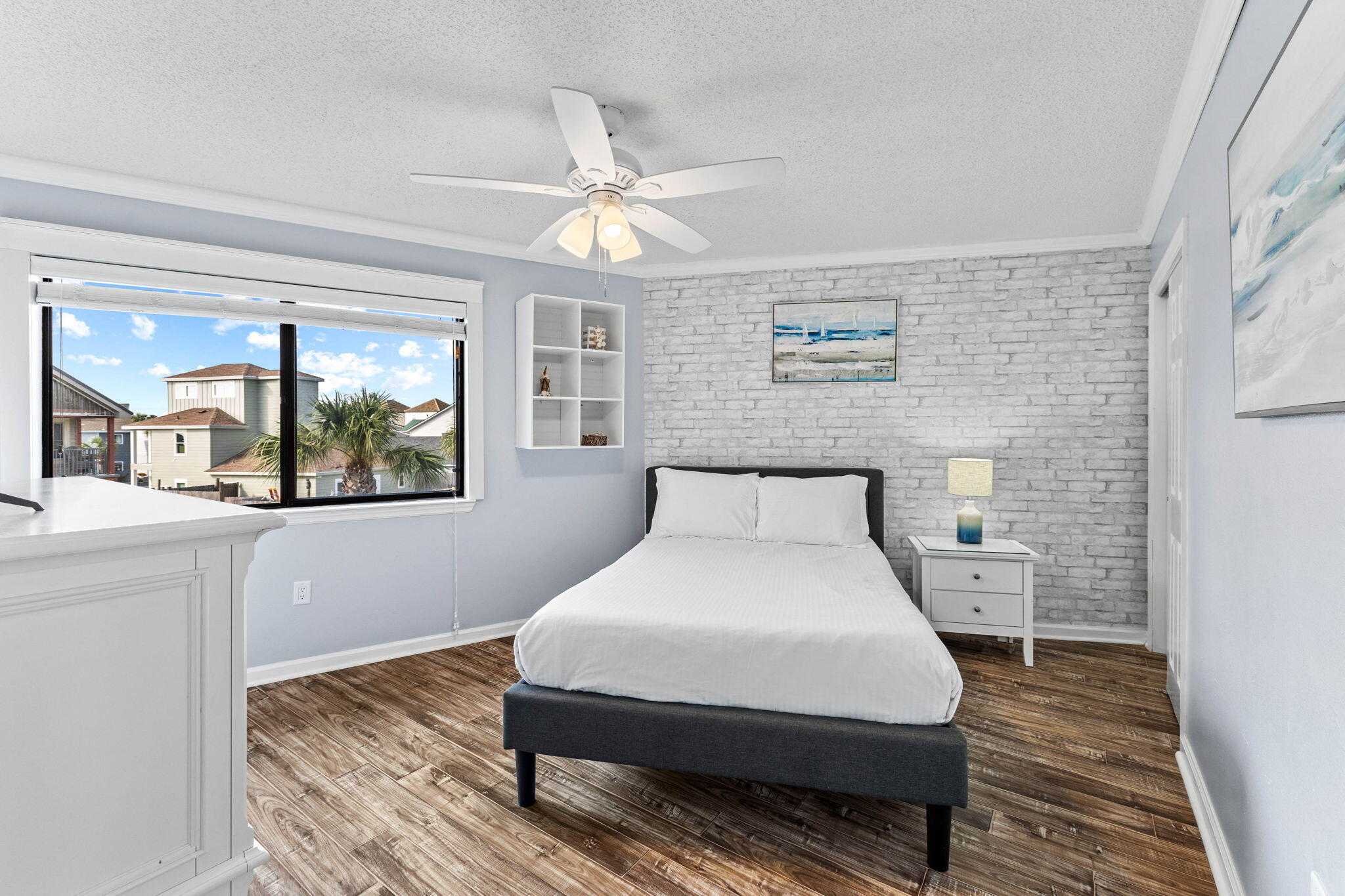 285 Payne Street, Unit 19B Destin, FL 32550 - Photo 17 of 29 a bedroom with a bed and wooden floor