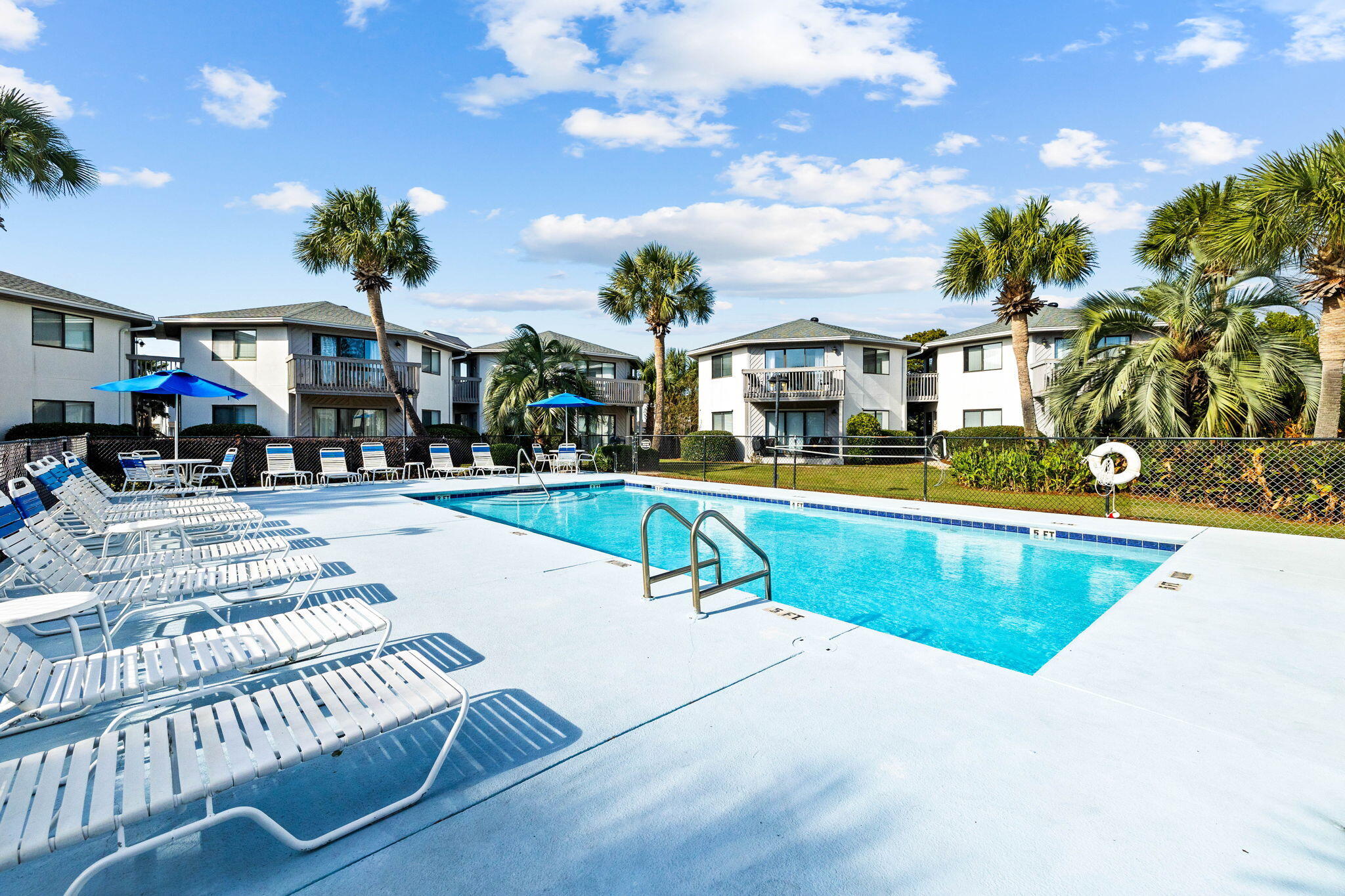 285 Payne Street, Unit 19B Destin, FL 32550 - Photo 27 of 29 a view of a swimming pool with outdoor seating