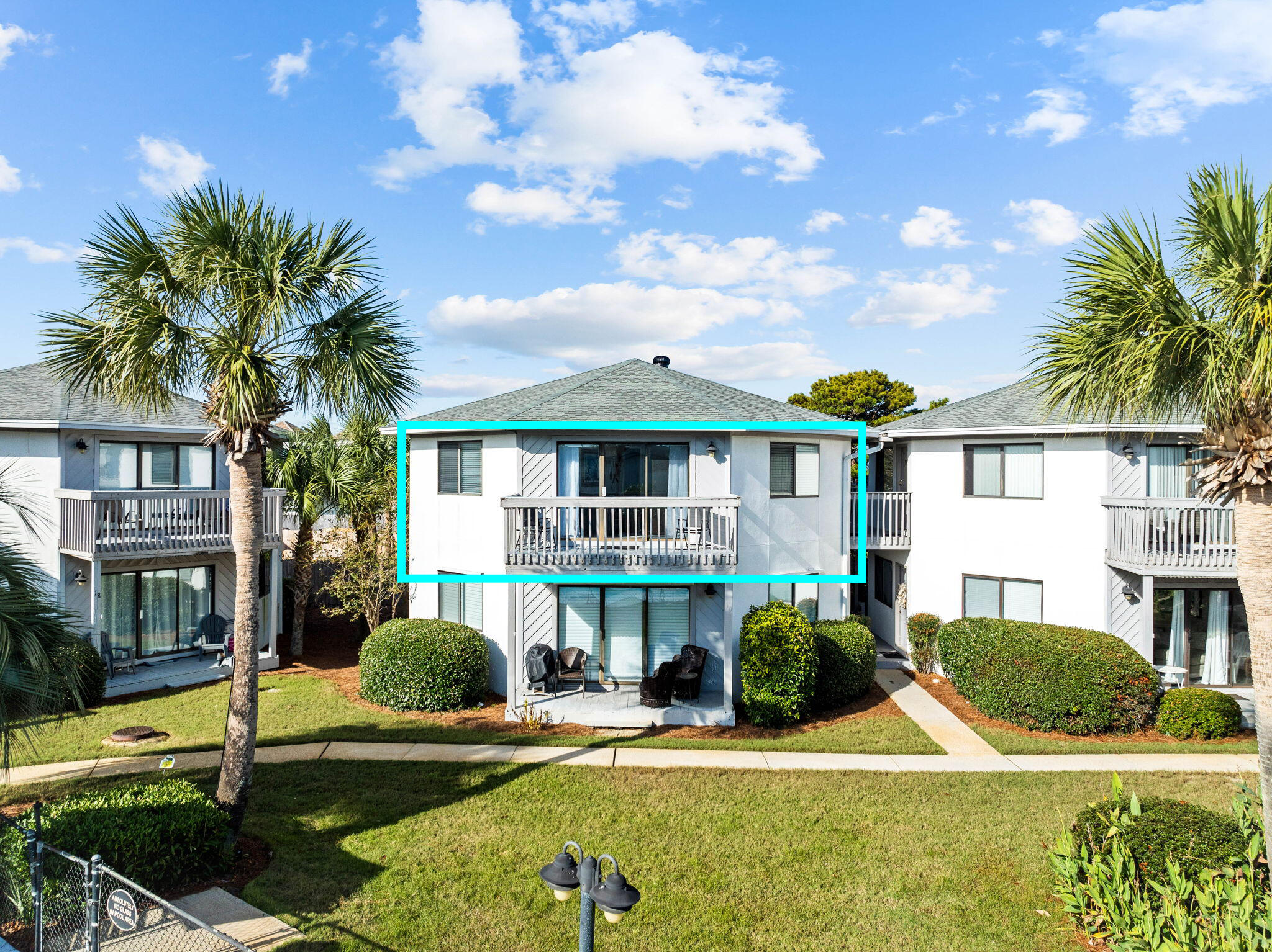 285 Payne Street, Unit 19B Destin, FL 32550 - Photo 29 of 29 a front view of a house with garden and trees