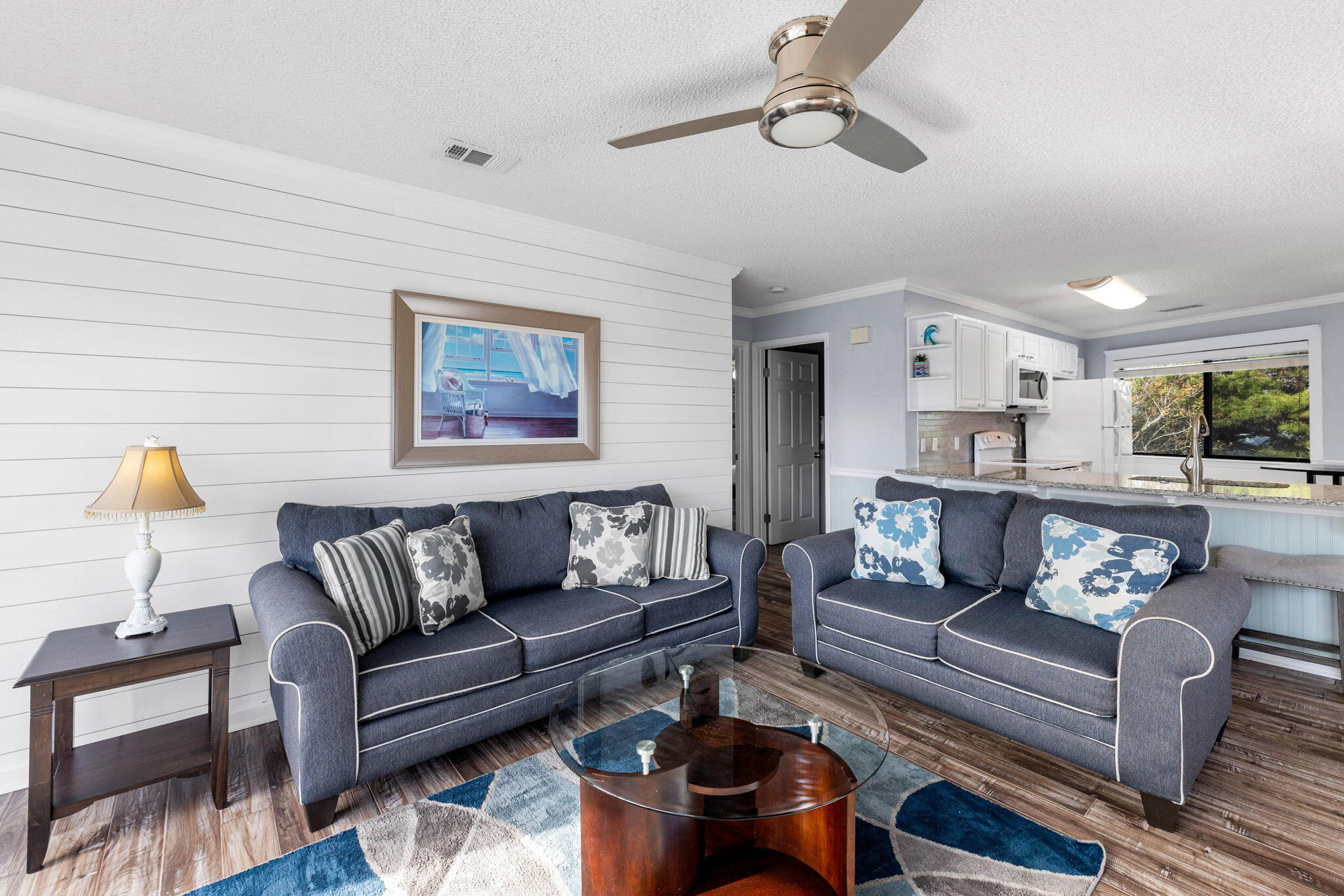 285 Payne Street, Unit 19B Destin, FL 32550 - Photo 6 of 29 a living room with furniture and wooden floor