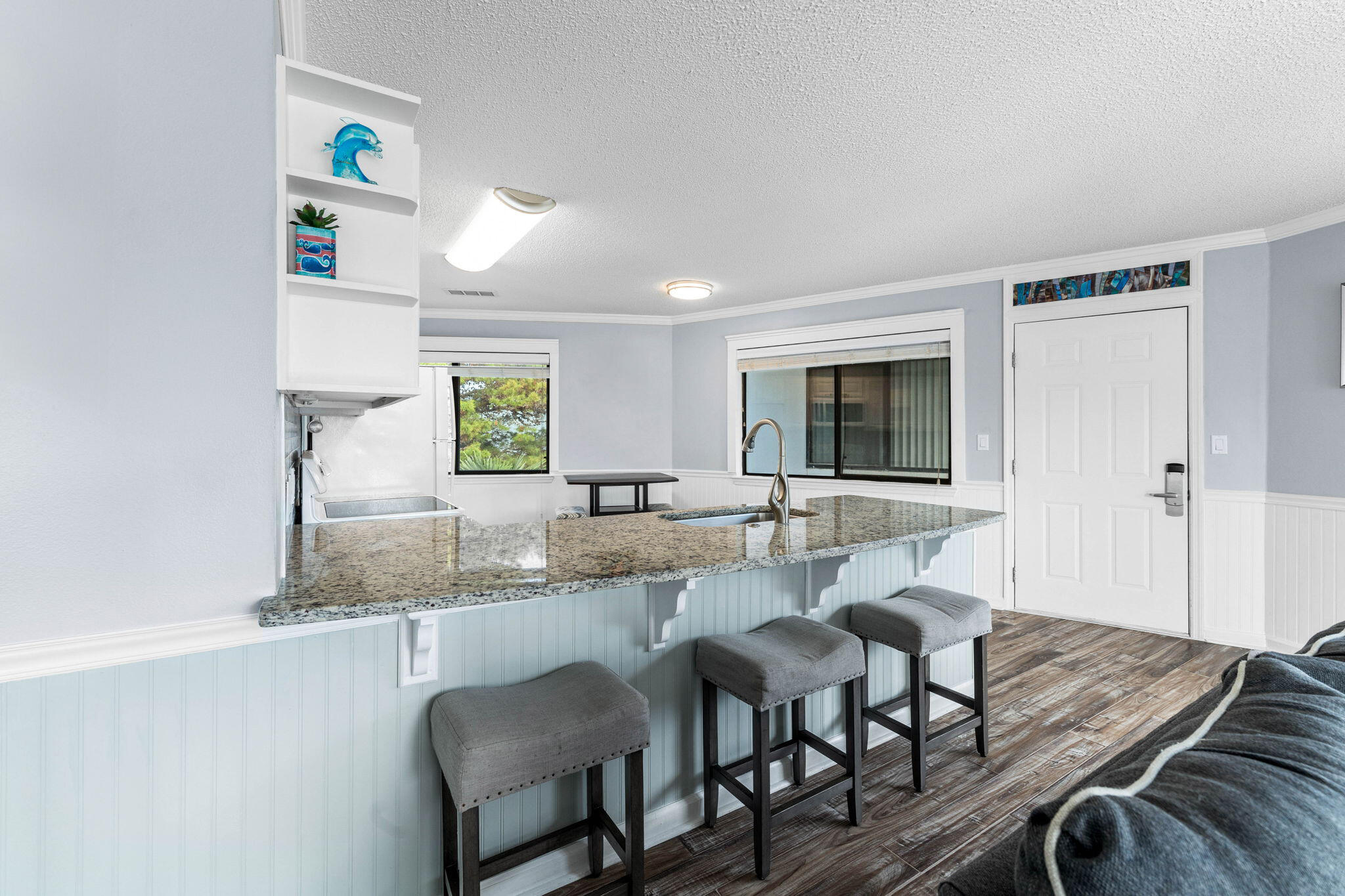 285 Payne Street, Unit 19B Destin, FL 32550 - Photo 8 of 29 a kitchen with a dining table chairs and large window