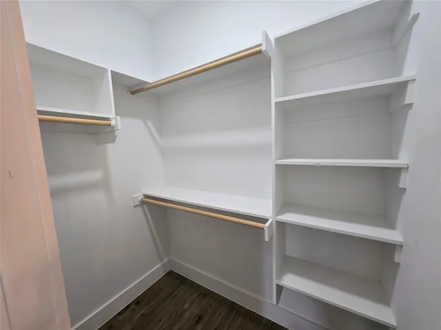 a view of an empty walk in closet