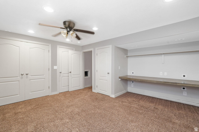 7936 Wycliffe Way Eagle Mountain, UT 84005 - Photo 21 of 37 4th Bedroom, Triple closets, built in desk, carpet, a ceiling fan, and recessed lighting