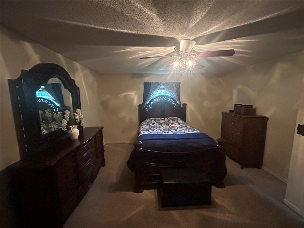 307 Mar-Mac Road Anderson, SC 29626 - Photo 15 of 19 A well-appointed sleeping sanctuary awaits, featuring a prominent ceiling fan for year-round comfort.