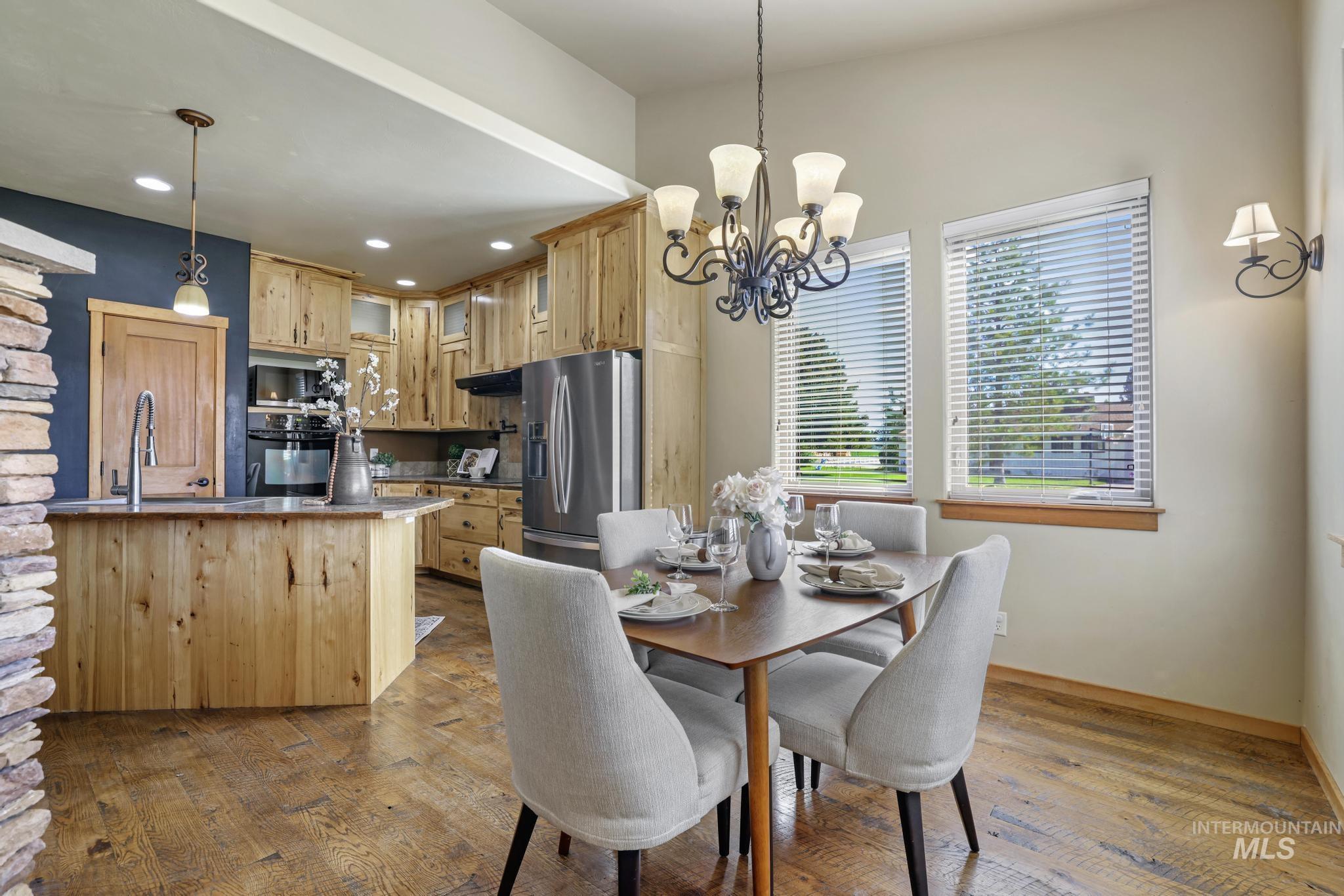 205 Edwards Drive Twin Falls, ID 83301 - Photo 17 of 49 Dining space with light wood-type flooring, a chandelier, and recessed lighting