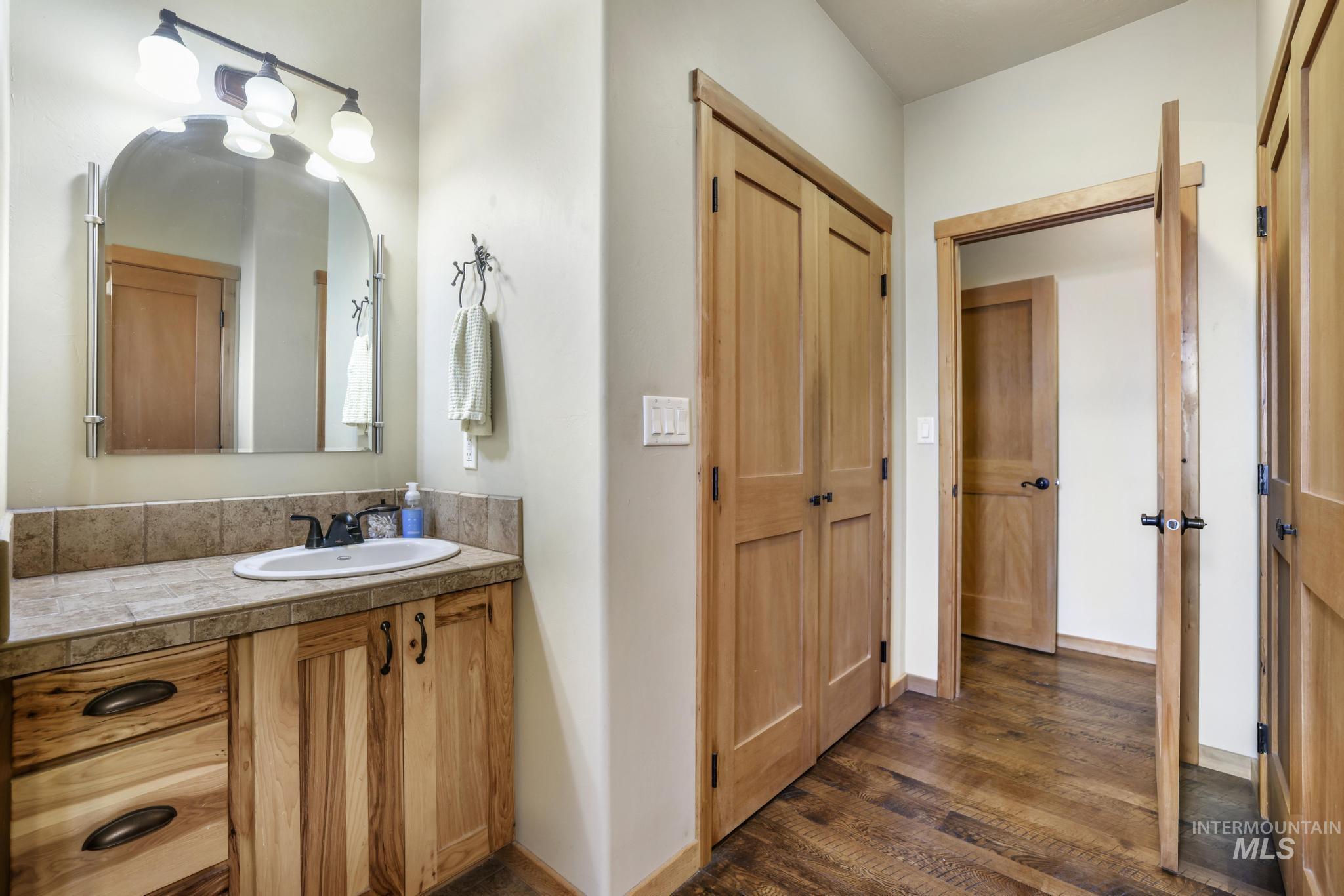 205 Edwards Drive Twin Falls, ID 83301 - Photo 25 of 49 Bathroom featuring vanity and dark wood-style flooring