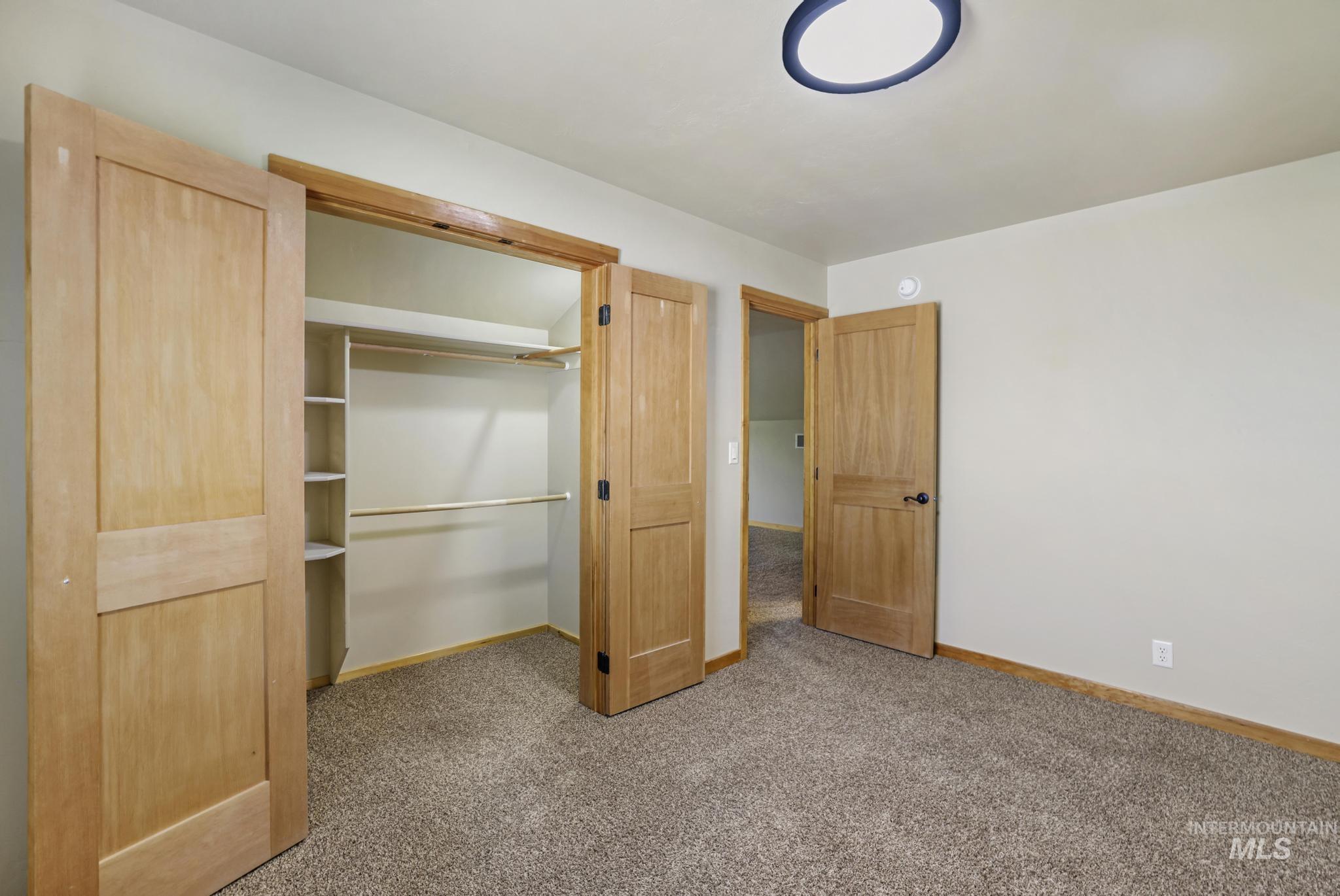 205 Edwards Drive Twin Falls, ID 83301 - Photo 30 of 49 Unfurnished bedroom featuring light carpet and a closet