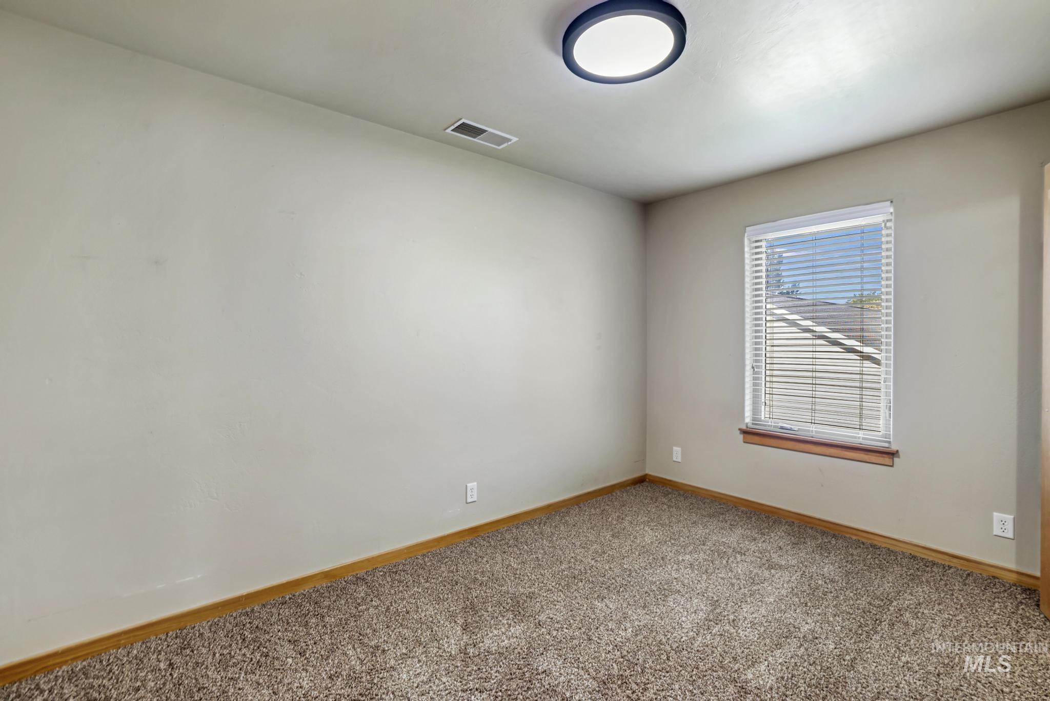 205 Edwards Drive Twin Falls, ID 83301 - Photo 31 of 49 Carpeted spare room with baseboards