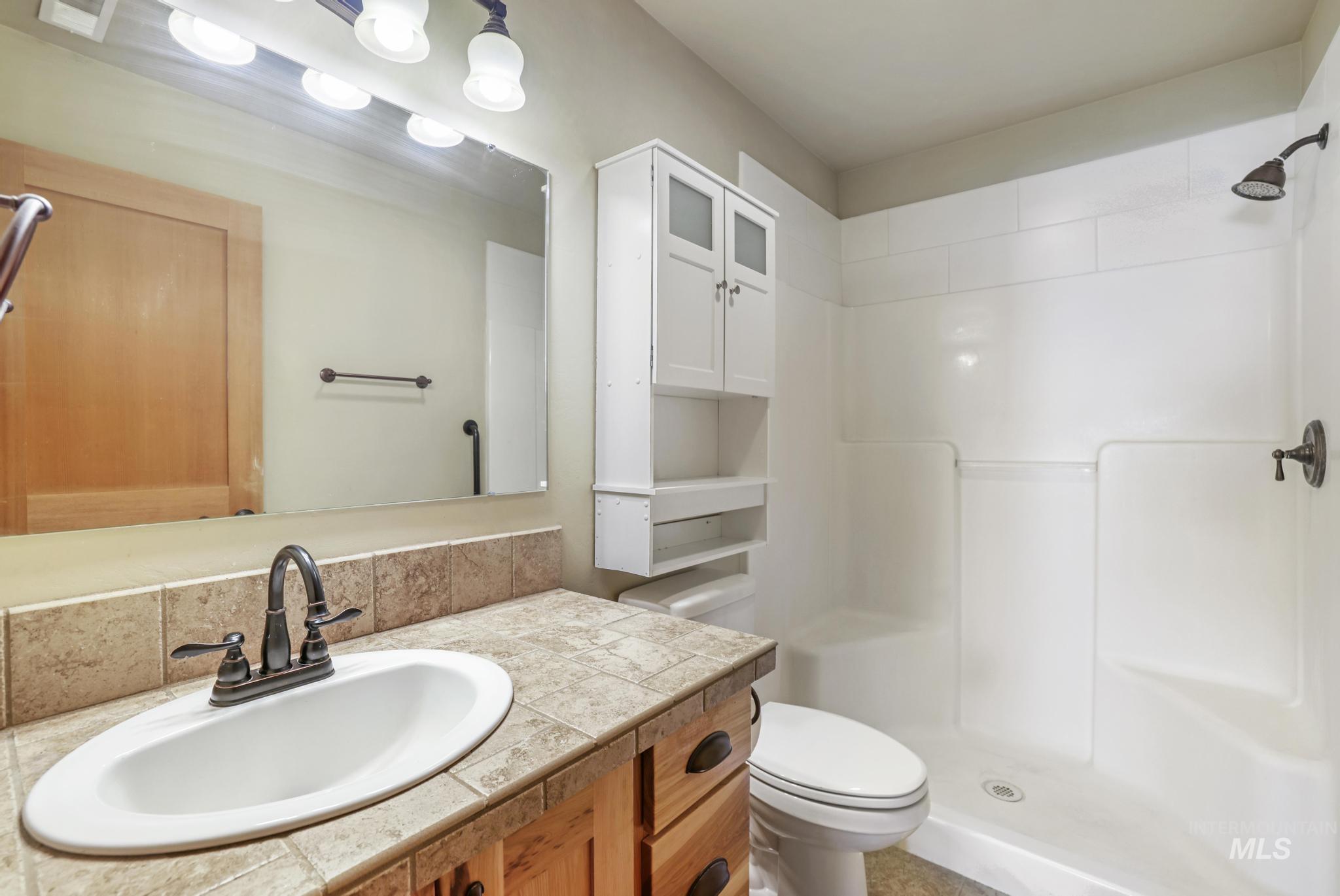 205 Edwards Drive Twin Falls, ID 83301 - Photo 32 of 49 Bathroom with vanity and a stall shower