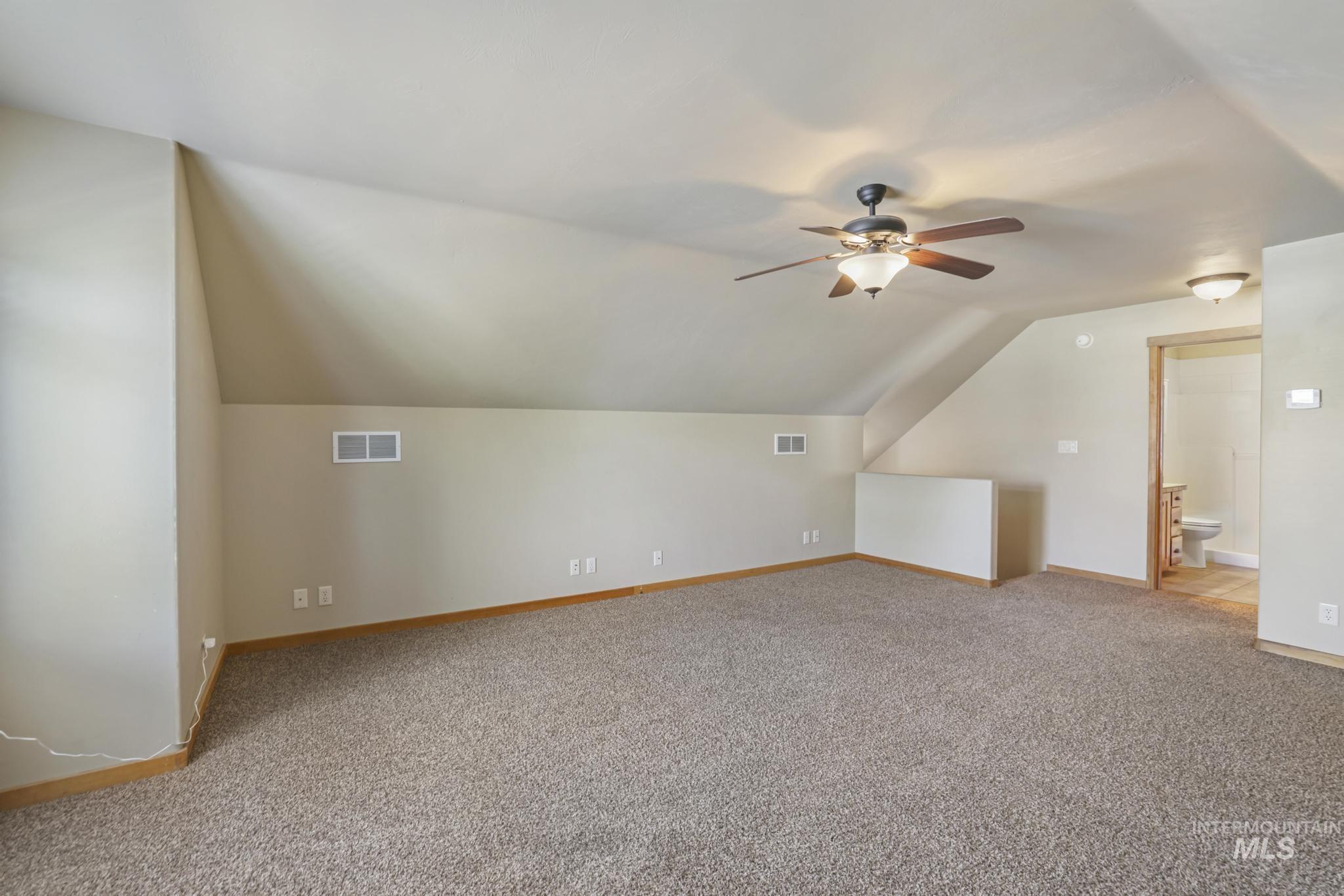 205 Edwards Drive Twin Falls, ID 83301 - Photo 33 of 49 Bonus room with lofted ceiling, light carpet, and a ceiling fan